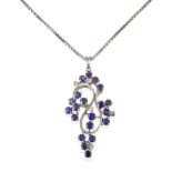 A Sapphire and Diamond Pendant on Chain, the abstract swirl motif pendant set throughout with