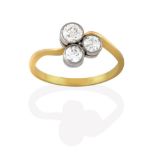 A Diamond Three Stone Ring, the old cut diamonds arranged as a cluster in white millegrain settings,