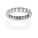 A Diamond Eternity Ring, the twenty old cut diamonds in white claw and channel settings, total