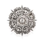 A Late 19th Century Diamond Brooch, of cluster star design, an old cut diamond centrally to a
