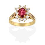 A Pink Tourmaline and Diamond Cluster Ring, the oval cut pink tourmaline within a border of round