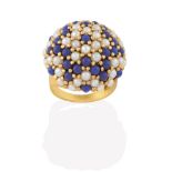 A Cultured Pearl and Blue Bead Ring, the bombé bezel formed of cultured pearls and blue beads in a
