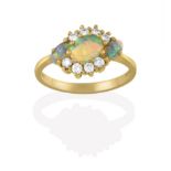 An 18 Carat Gold Opal and Diamond Cluster Ring, the three oval cabochon opals within a border of