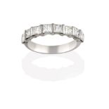 A Diamond Half Hoop Eternity Ring, the princess cut diamonds spaced by white bars, to a plain