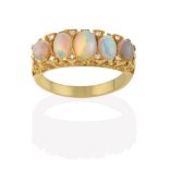 An Opal and Diamond Ring, the five graduated oval cabochon opals with eight-cut diamond accents,
