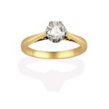 A Diamond Solitaire Ring, the round brilliant cut diamond in a white claw setting, to a tapered