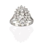 A Diamond Cluster Ring, three round brilliant cut diamonds within a double stepped border of round