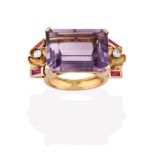 An Amethyst Ring, the emerald-cut amethyst in a yellow claw setting, flanked by foliate motifs