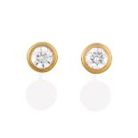 A Pair of Diamond Solitaire Earrings, the round brilliant cut diamonds in yellow rubbed over