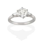 A Platinum Diamond Solitaire Ring, the round brilliant cut diamond in a claw setting, to a tapered