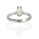 A Diamond Solitaire Ring, the marquise cut diamond in a white claw setting, to a tapered shoulder