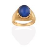 A 14 Carat Gold Synthetic Sapphire Ring, the cabochon synthetic star sapphire in a yellow rubbed