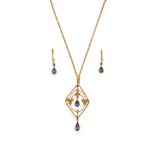 An Edwardian Sapphire and Seed Pearl Pendant on Chain, of openwork foliate lozenge design, with an