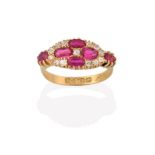 An 18 Carat Gold Synthetic Ruby and Diamond Cluster Ring, four oval cut synthetic rubies with an old