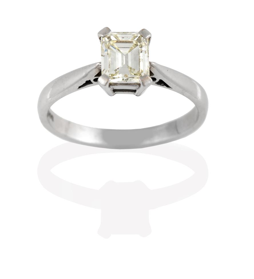 An 18 Carat White Gold Diamond Solitaire Ring, the emerald-cut diamond in a four claw setting, to