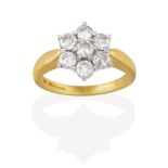 An 18 Carat Gold Diamond Cluster Ring, seven round brilliant cut diamonds, in white claw settings,
