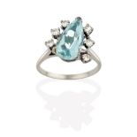 An Aquamarine and Diamond Ring, the pear cut aquamarine flanked by trios of round brilliant cut