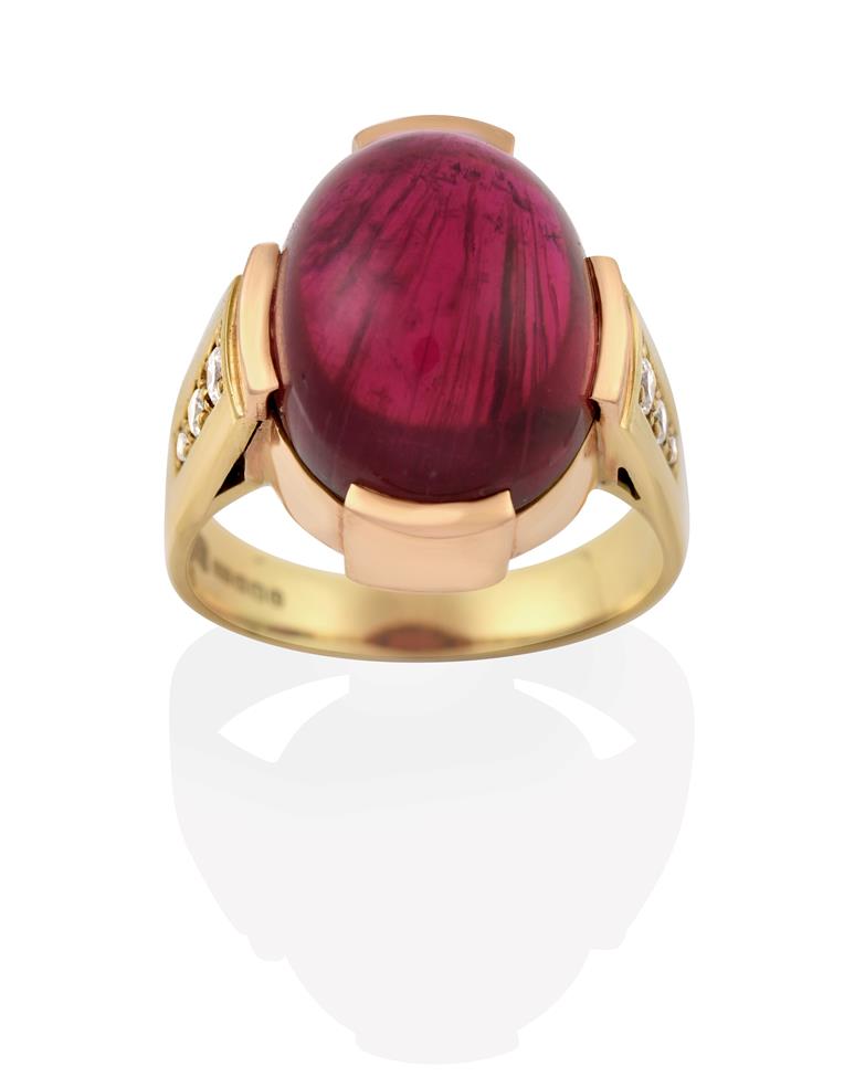 An 18 Carat Gold Pink Tourmaline Ring, the oval cabochon pink tourmaline in a yellow claw setting,