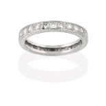 A Diamond Eternity Ring, the twenty-six round brilliant cut diamonds in white claw and channel