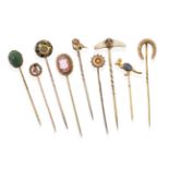 A Collection of Nine Stickpins, comprising of a cornelian cameo shield example; a scarab example; an