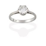 A Diamond Solitaire Ring, the old cut diamond in a white claw setting, to a tapered shoulder plain