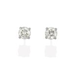 A Pair of 18 Carat White Gold Diamond Solitaire Earrings, the round brilliant cut diamonds in four