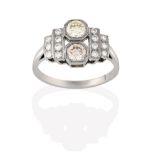 An Art Deco Style Diamond Ring, two round brilliant cut diamonds set perpendicular to the shank,