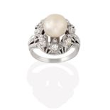 A Cultured Pearl and Diamond Cluster Ring, the cultured pearl within a spaced double border of old