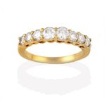 A Diamond Eight Stone Ring, the graduated round brilliant cut diamonds, in yellow claw settings,