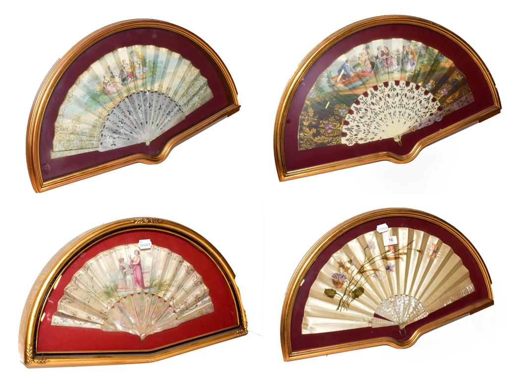 ~ Four fans each in a gilt framed wall hanging display case, including a silk example embroidered