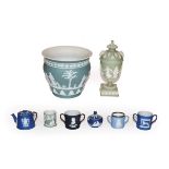 A group of Wedgwood Jasper ware including a vase, urn and cover, twin handled cups etc. Miniature