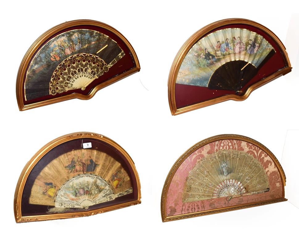 ~ Four fans each in a gilt framed wall hanging display case, comprising two with bone sticks and