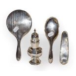 A silver baluster form caster together with three silver backed dressing table items