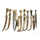~ A quantity of Indian metal mounted kinjhals in scabbards and a horn scabbard with turquoise and