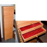 An eighteen-drawer part fitted shop keepers pen cabinet