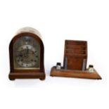 A Reid & Sons checkered string inlaid mahogany veneered striking mantel clock, the silvered arch