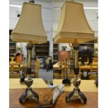 A pair of modern silvered and bronzed composite table lamps, each of column form on triform bases,