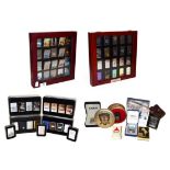 ~ A quantity of Zippo lighters, some in collectors tins (2 display cases and 2 trays)