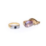 ~ A synthetic sapphire and diamond three stone ring, unmarked, finger size P1/2; and an amethyst