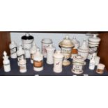 ~ A quantity of Spanish pottery and opaque glass apothecary jars and other storage vessels and