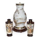 An early 20th century Japanese vase decorated with birds on a hardwood stand 36cm (including