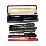 A Waterman's fountain pen with nib stamped 14ct, a Conway 106 fountain pen, a Golden Sovereign