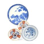A Chinese blue and white dish; a Japanese black and white charger and two Spode dishes in Imari