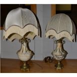 A pair of Neo-Classical style gilt metal mounted marble table lamps of urn form and ornamented
