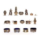 A collection of assorted silver condiment Items, including: a pair of pepperettes, chased with