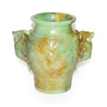 A carved green hardstone twin-handled vase with Oriental design, 20cm high