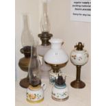 Six Victorian oil lamps, including glass examples with enamel decoration (6)