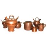 ~ A collection of antique copper vessels probably South American, including flagons and twin handled