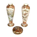 ~ A pair of Japanese Meiji period slender Satsuma vases decorated with figure and landscape panels