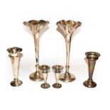 A group of silver vases, including: a pair by R & W Sorley, London, 1901, 25.5cm high; a pair by